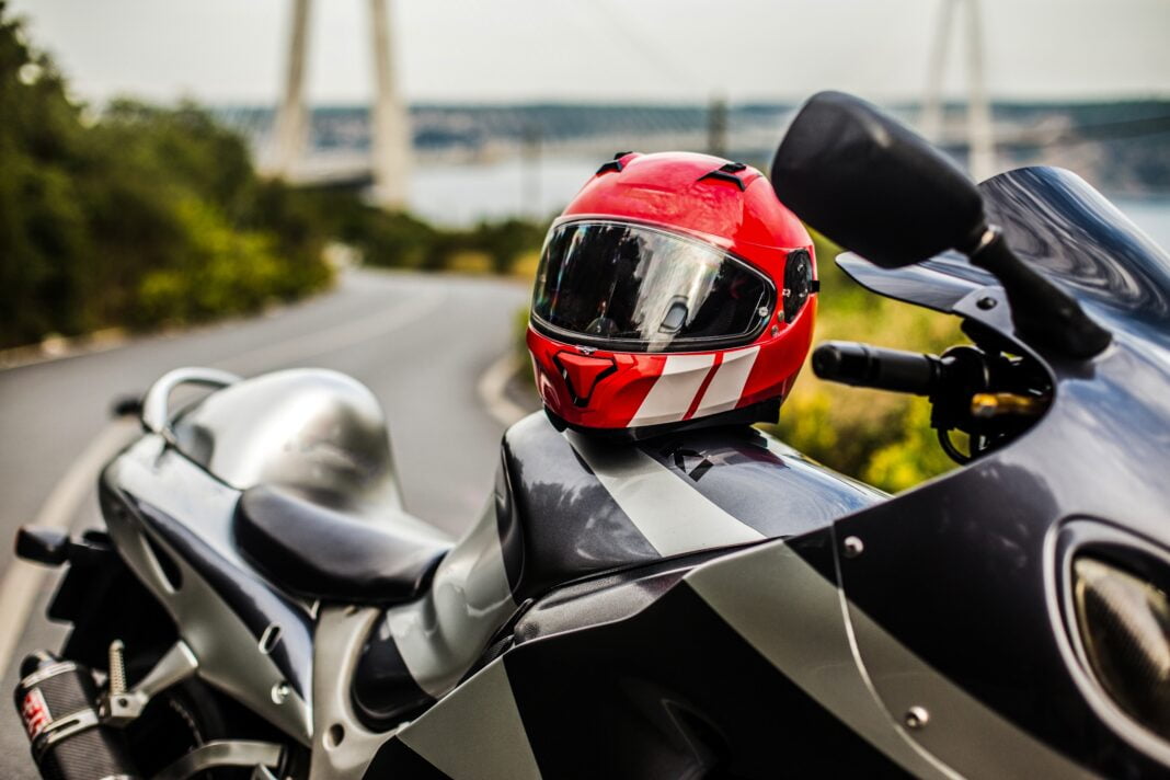 grey-black-motorcycle-red-helmet